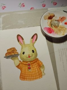 a painting of a bunny holding a plate of food