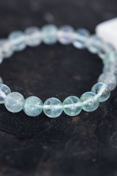 This crystal Fluorite bracelet is for anyone on a growth journey! Wear it every day and remember that what you focus on, grows. Growth is life, keep going. Fluorite, the growth stone, clears your mind, opens your heart & aligns you with your highest self. AAA quality smooth Fluorite beads, 8mm Strung on an elastic strand that easily slips on your wrist Handmade in Arizona Bracelet size guide Because all crystals & gemstones are unique they may vary in appearance. Hypoallergenic Round Crystal Bracelet For Healing, Healing Mineral Crystal Bracelet, Round Hypoallergenic Crystal Bracelet For Healing, Healing Clear Gemstone Beads Jewelry, Minimalist Crystal Bracelet With Round Beads For Healing, Minimalist Round Beads Crystal Bracelet For Healing, Minimalist Crystal Bracelet With Gemstone Beads For Healing, Clear Gemstone Beads Jewelry For Healing, Spiritual Clear Jewelry For Healing