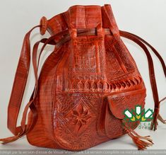 Looking for a stunning, handmade Moroccan leather bag? Moroccancraftdream offers beautiful handmade leather bags in various colors, crafted from durable, genuine leather. Our vintage leather handbags feature intricate ethnic patterns, with floral and geometric embossing, camels, palm trees, and an oasis, giving it a bohemian and hippie feel. This large leather bag is perfect for everyday use as a boho shopper for women. Stand out with this classic 1970s-inspired Moroccan leather bag, hand-emboss Traditional Brown Soft Leather Bag, Traditional Soft Leather Satchel Bag, Traditional Hand Tooled Bag For Daily Use, Traditional Soft Leather Bag, Traditional Hand-tooled Bag For Daily Use, Traditional Hand Tooled Pouch Bag, Traditional Satchel With Removable Pouch, Traditional Leather Shoulder Bag, Traditional Leather Bags With Removable Pouch