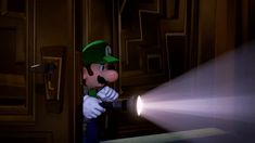 a nintendo wii video game with mario pointing at the light coming from his arm and head