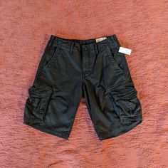 Gap Khakis Shorts In Black Size: Mens 29 New With Tags Black Color Looks A Little Washed Out Gap Black Casual Pants, Casual Black Gap Pants, Gap Black Relaxed Fit Bottoms, Relaxed Fit Black Shorts With Multiple Pockets, Black Relaxed Fit Shorts With Multiple Pockets, Black Cargo Shorts With Hip Pockets, Black Casual Cargo Shorts, Gap Short Bottoms With Pockets, Gap Bottoms With Pockets, Short