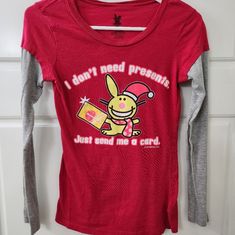 Nwot Red & Gray Bunny Graphic Print Long Sleeve Graphic Bunny Tee Red, Gray & White Bunny Graphic Print On The Front Crew Neckline Long Sleeves Straight Hemline Pullover Styling Tag Says Small But Fits More Like 14 All Offers Are Welcomed! Professional Seller, Smoke-Free Home, And Same Or Next Day Shipping. Like Items For Price Drops. Receive A Bundle Discount When You Purchase Two Or More Items. Please Message With Any Questions. New To Poshmark? Sign Up With My Code Alexmcderm And Receive $10 Cute Red T-shirt For Winter, Cute Red Winter T-shirt, Cute Red Winter Tops, Playful Red Christmas Tops, Red Fitted Fun Top, Playful Fitted Red Tops, Fitted Fun Red Top, Fun Fitted Red Tops, Cute Red Long Sleeve Tops