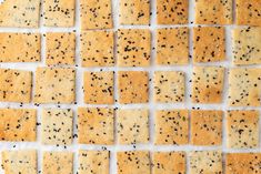 crackers are arranged in rows on a white surface