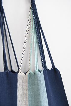 These versatile totes are handwoven by artisans in Chiapas, Mexico on a backstrap loom. Perfect for a beach day, the farmer's market, or as an everyday purse! Designed by and created exclusively for The Global Trunk. This bag is approx. 16" wide x 26" tall with the strap. Due to the handmade nature, height and width of bag can vary up to 10%. Eco-friendly Handwoven Blue Beach Bag, Eco-friendly Blue Handwoven Beach Bag, Blue Handwoven Beach Bag For Market, Blue Handwoven Beach Bag, Blue Woven Beach Bag For Market, Blue Fair Trade Beach Bag, Fair Trade Blue Beach Bag, Blue Weaving Beach Bag, Blue Beach Bag With Weaving Detail