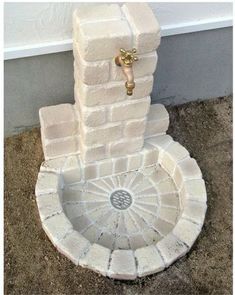 a white toilet sitting on top of a sidewalk