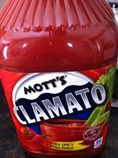 a bottle of tomato juice sitting on top of a counter