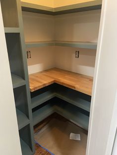 empty shelves in the corner of a room