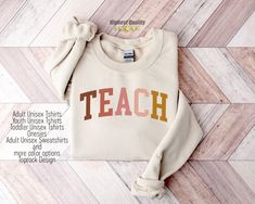 "Teach Sweatshirt Tshirt,Teacher Sweatshirt,Teacher Shirt,Cute Shirt for Teachers,Teacher Gifts,Elementary School Teacher Shirt,Group Teacher 📢 🚨How To Order?🚨📢 📺 Please, check and review all photos 📐 Select Shirt Size and Color from Drop Down menu After choosing the color and size, you can write whatever you want in the personalization field. (If it's a customizable ad) and then add this tshirt to cart. Just do this for other t-shirts. You must collect all tshirts in the same basket and complete the payment. If you are in a hurry, you can purchase a Shipping upgrade on the checkout page. 🛀 Care Instructions - DO Inside out before wash, - DO warm/cold machine wash - DO NOT bleach, - DO NOT dry clean, - DO NOT iron directly onto the design 🚀 Shipping You can also see in the customer Teacher Sweatshirt Ideas, Sweatshirt Ideas, School Sweatshirts, Teaching Shirts, Teacher Sweatshirt, Teacher Appreciation Gift, New Teachers, Look Plus, Mama Shirt