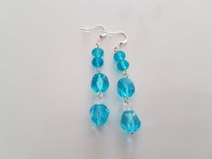 Earrings, Dangling Earrings, Glass Beads, Blue, Sky Blue, Transparent, Metallic Details, Gift, Gift For Her, Gift For Women Dangling earrings with round glass beads, metal parts.  These earrings are for a woman who loves unique handmade jewelry. I do not repeat my products. Dangling earrings, blue glass beads with metal parts. The length of the earrings is 5 cm (1.97 inches)  They are made of  blue transparent glass beads, connected with metal parts.  These earrings are ready to ship. You can choose unique handmade gifts for women from my stores https://www.etsy.com/shop/Reriros and https://www.etsy.com/shop/ReriroHandmade It is made in a pet-free and smoke-free home environment. This item is not suitable for babies and small children. Please note that due to differences in monitor setting Blue Crystal Earrings With Faceted Beads As Gift, Blue Round Bead Crystal Earrings For Gifts, Blue Crystal Round Bead Earrings, Blue Crystal Round Bead Earrings For Gift, Blue Round Beads Crystal Earrings For Gift, Blue Faceted Beaded Crystal Earrings, Blue Crystal Earrings With Faceted Beads, Blue Crystal Earrings With Dangling Beads For Gift, Blue Beaded Earrings With Faceted Beads As Gift