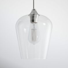 a clear glass light fixture hanging from a ceiling