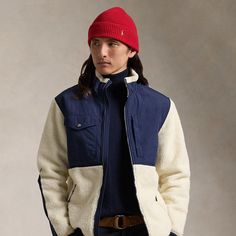 This fleece jacket features a contrasting woven overlay and wind-blocking properties for added protection. Ralph Lauren Long Sleeve Outerwear For Outdoor, Fall Outerwear With Contrast Panels And Long Sleeves, Ralph Lauren Winter Outerwear For Outdoor, Ralph Lauren White Winter Outerwear, Navy Winter Outerwear For Layering, Navy Outerwear For Winter Layering, Navy Ralph Lauren Long Sleeve Outerwear, Wind Blocking, Chelsea Boots Mens