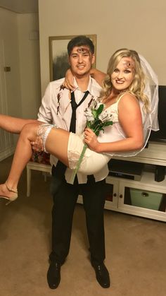 a man and woman dressed up as bride and groom posing for the camera with their legs wrapped around each other