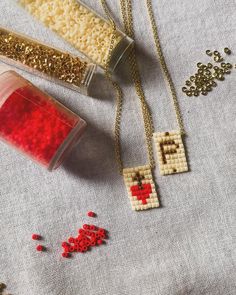 some beads and other items are laying on a table with bead sprinkles