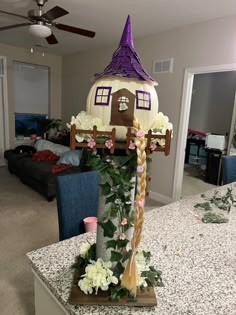 Rapunzel tower made out artificial pumpkin, pvc, stone spray paint, and wood. Rapunzel Pumpkin Ideas, Book Themed Painted Pumpkins, Rapunzel Pumpkin Painting, Pumpkin Decorating Disney, Group Pumpkin Decorating Ideas, Book Character Pumpkins Contest, Creative Pumpkin Painting Contest, Rapunzel Pumpkin, Tangled Pumpkin