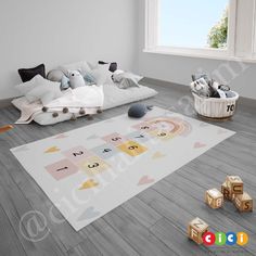 a child's playroom with toys on the floor and rug in front of it