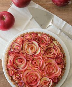 an apple pie with red onions on top