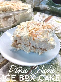 a white plate topped with a piece of cake next to a casserole dish