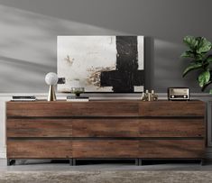 a large wooden dresser sitting in a living room next to a painting on the wall