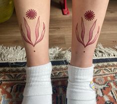 two women with matching tattoos on their legs