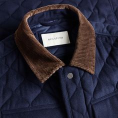 This diamond quilted field jacket, crafted from wool and cashmere, blends functionality and timeless appeal. It features a fully quilted nylon lining for warmth, a two-way zipper, a covered placket with snaps for added protection, adjustable cuffs and adjustable side vents for enhanced mobility. Classic details include a corduroy collar and multiple utility pockets. Luxury Outerwear With Patch Pockets, Luxury Quilted Puffer Jacket For Fall, Luxury Quilted Puffer Jacket, Luxury Quilted Puffer Jacket For Winter, Luxury Navy Wool Outerwear, Designer Navy Outerwear With Pockets, Luxury Quilted Outerwear For Outdoor, Navy Quilted Outerwear For Fall, Blazer And T Shirt