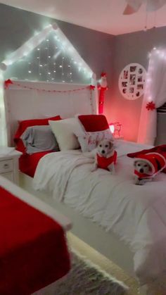 a bedroom decorated in red and white for christmas