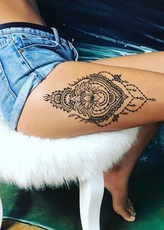 a woman's leg with a tattoo on it