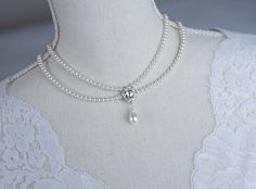 Vintage, Romantic Style White CZ  Necklace, Victorian Wedding Pearl and White CZ Bridal Choker,  Romantic Multi Row Vintage Swarovski Pearl  Materials used: - White/Ivory Cream Swarovski pearls - cubic zirconia stones - rhodium plated over brass The necklace will arrive packaged ready for gift giving in a delicate white jewelry box with a silver ribbon. Matching earrings for this necklace:  Back to my shop http://www.etsy.com/shop/crinadesign73 Thank you for visiting my store! Classic Pearl White Bridal Necklace For Wedding, Sewing Wedding Dress, Victorian Necklace, Bridal Pearl Necklace, Bridal Choker, Pearl Bridal Jewelry, White Jewelry Box, Victorian Wedding, Cz Necklace