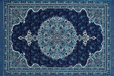 a blue rug with an intricate design on it