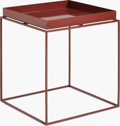 a square metal and wood side table with a red tray on it's top