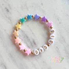 This adorable pastel rainbow star bracelet is handmade with love by a momma to two little girls! I hope you enjoy this fun and sweet little accessory. Click to shop now! ❤ HELPFUL TIPS ❤ ❤ Additional sizes available- just message me ❤ Do not get your bracelet wet ❤ Bracelets are made with strong stretchy elastic made for jewelry making ❤ Handle with care when taking on and off ❤ All bracelets are final sale - double check spelling ❤ Some beads present a potential choking hazard for little ones, Bracket Ideas, Boho Kids, Rainbow Star, Big Sis, Star Bracelet, Name Bracelet