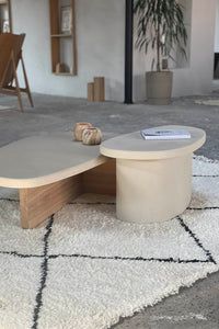 a coffee table sitting on top of a white rug