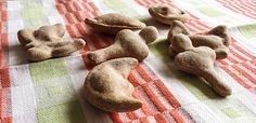 several dog treats are laying on a checkered tablecloth