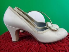 Items come from a smoke and pet Free home! Tracking Included!  These lovely elegant 1940s 50s shoes features decorative steel square bars on the top of the vamp, an elastic band that makes a comfy easy wear edge, a peep toe, and smooth finish! Perfect for a gift or to collect or for any outfit or occasion you desire! Measurements  Height 2 1/2 Inches 6.20 cm  Length 9 1/2 Inches 24 cm Width 2 7/8 Inches 7.20 cm Heel 2 3/4 Inches 4 1/2 cm Maker: FORST BROS. Conditions: Excellent! Very light wear 50s Shoes, 60s Shoes, 50s Women, Shoes Heels Pumps, Pumps Shoes, Leather Pumps, Easy Wear, Womens Heels, Pump Shoes