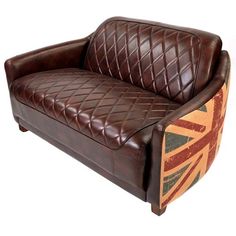 a brown leather couch sitting on top of a white floor