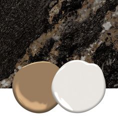 two different shades of paint sitting next to each other on a white surface with black and brown marble