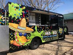 an ice cream truck is decorated with colorful designs