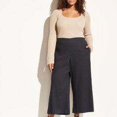 Secured With A Jewel-Like Metal Button, Our High-Waisted Pant Open To A Sculptural Shape Before Tapering Down To A Cropped Hem. * Plus Size. * Hidden Side Zip. * Metal Button Closure. * 69% Linen, 31% Polyester. * Imported. Casual Stretch Culottes For Work, Casual Ankle-length Culottes For Business Casual, Fitted Casual Culottes, Business Casual Ankle-length Culottes, High Waist Casual Culottes For Workwear, Versatile Fall Workwear Culottes, Casual Fall Workwear Culottes, Casual Fitted Culottes For Work, Beige Linen Pants