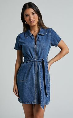 Get ready to turn heads in the Nandini Mini Dress - Zip Through Denim Dress In Blue. This trendy shirt dress is perfect for any weekend activity, with its casual denim fabric and stylish collar. Made from soft cotton, it's comfortable enough for all-day wear. The short sleeves add a touch of femininity to this mini dress, making it a must-have addition to your wardrobe. Whether you're heading out with friends or dressing up for a date night, this blue denim dress will give you that effortlessly Denim Dress Styling, Dress Styling Ideas, Dress Styling, Blue Denim Dress, Latin Quarter, Denim Shirt Dress, Trendy Shirts, Styling Ideas, Casual Denim