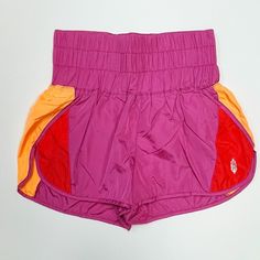 Note: This Colorway Arrived With A Strange Print Mark Around The Logo On The Front Of The Short. They Are Minor, But Price Reflects. Please Note This Before Purchasing. Thanks! Product Details Speed Up Or Slow Down In These Breezy, Warm-Up Style Running Shorts, Featuring A Boldly Smocked Waistband With A High-Rise Silhouette And Split Hem. Pull-On Style Stretch Waistband Relaxed Fit Fp Movement A Destination For The Life Well-Lived, Free People Movement Offers Performance-Ready Activewear, Pract Pink Nylon Bottoms With Built-in Shorts, Pink Fitted Athletic Shorts For Summer, Fitted Pink Athletic Shorts For Summer, Pink Stretch Shorts For Beach, Pink Stretch Shorts For The Beach, Multicolor Athletic Shorts With Built-in Shorts, Pink Sports Shorts With Elastic Waistband, Stretch Color Block Bottoms, Short Shape, Pink Athletic Shorts With Elastic Waistband For Gym