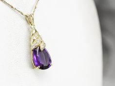 We love this modern amethyst piece, crafted in the mid-1990's this piece features a beautiful cut amethyst accented perfectly by the polished yellow gold mounting glitter with diamond, ready to wear or gift this is the perfect piece to transition from office to date night! This pendant does not come with the chain shown. Please feel free to contact us, we will help you find the perfect chain for your style and budget! Metal: 14K Yellow Gold Gem: Amethyst Gem Measurements: 10 x 12 mm, Pear Cut Ac Fancy Jewelry Necklace, Snowflake Pendant, Gold Snowflake, Amethyst Gem, Star Bracelet, Teardrop Pendant, Fancy Jewelry, Trendy Jewelry, Pear Cut