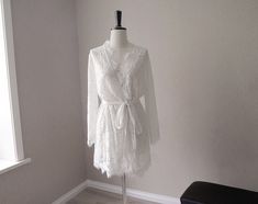 Very lovely robes, sheer lace fabric, will be perfect for wedding or honeymoon, or photoshoot. The lace fabric is very delicate, it looks pretty but fragile, iron/steam it with very low heat, handwash it and hang dry. Don't use high heat, or you'll burn the fabric. Size: Free size M can fit most, which would be good for hips measurements under 40 inches. if you need plus size, we can do that, please contact My height 5'4, 34 inches on me is mid thigh length Note: Please know each robe is handmad Long Lace Robe For Wedding Night, Delicate Lace Robe For Wedding Night, Sheer Lace Wedding Robe, Sheer Long Sleeve Wedding Robe, Long Sleeve Lace Wedding Robe, Fitted Lace Robe For Loungewear, Wedding Night Lace Sleepwear With Lace Sleeves, Wedding Night Sleepwear With Lace Sleeves, Lace Sleepwear With Lace Sleeves For Wedding Night