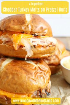 three cheddar turkey melts on pretzel buns with dipping sauce