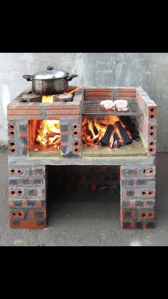 an outdoor grill made out of bricks with a pot on it's burner