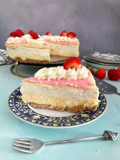 two slices of cheesecake with strawberries on top