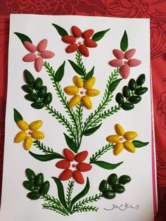 a card with flowers and leaves on it