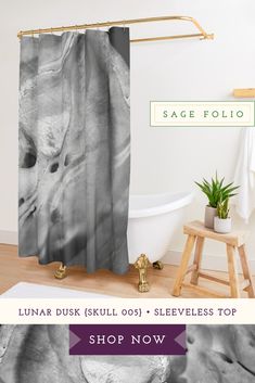 a black and white photo of an elephant shower curtain with the text, shop now