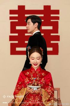 a man and woman dressed in traditional chinese clothing