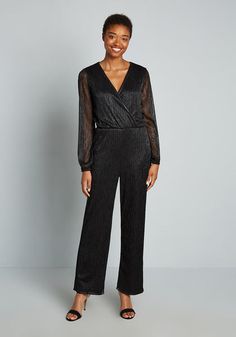 Own the night in this vintage-inspired, shimmering black jumpsuit! Perfect for a special occasion or anytime you feel like shining your brightest, this formal jumpsuit is a real showstopper. Glamorous Evening Jumpsuits For Fall, Chic Long Sleeve Jumpsuits And Rompers For Holiday, Elegant Fitted Shimmer Jumpsuits And Rompers, Elegant Fitted Jumpsuits And Rompers With Shimmer, Elegant Shimmer Jumpsuit For Night Out, Elegant Shimmer Jumpsuits And Rompers For Night Out, Shimmer Jumpsuits And Rompers For Evening Parties, Holiday Party Pants, Vintage Style Swimwear