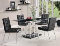 a glass dining table with black chairs around it