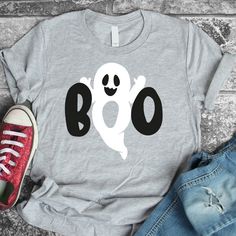 a t - shirt that says boo with a ghost on it